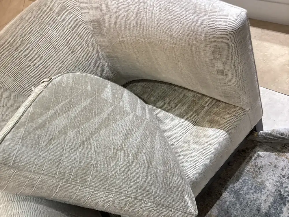 Textured fabric armchair after professional upholstery steam cleaning