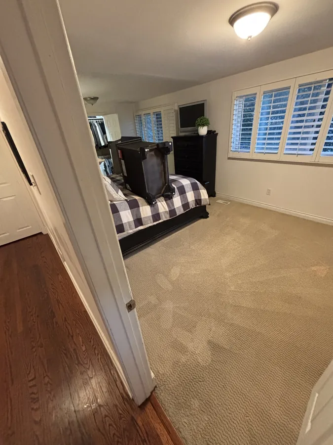 The same Brampton bedroom after hot water extraction, carpet groomed and even in tone