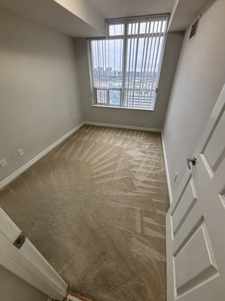 Vacant Mississauga City Centre condo bedroom with the carpet freshly cleaned by hot water extraction